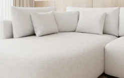 Designer Ecksofa Ando mit breiter Ottomane in Strukturstoff