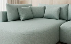 Designer Ecksofa Ando mit breiter Ottomane in Strukturstoff