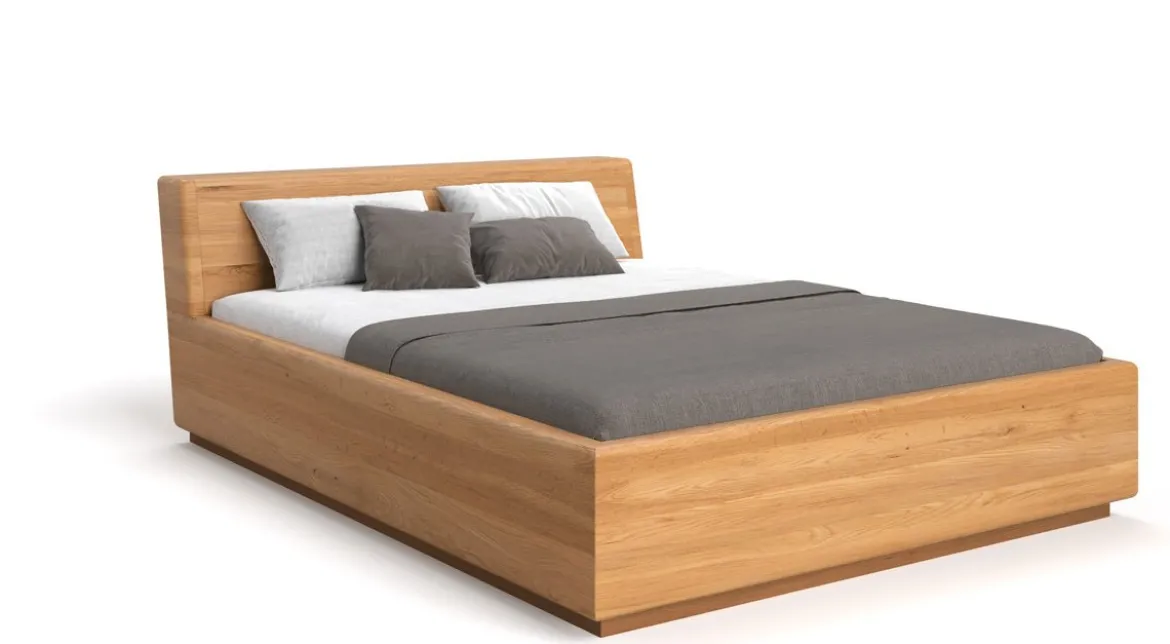 Designer Holzbett Calveno aus massiver Eiche mit Stauraum und geneigtem Headboard