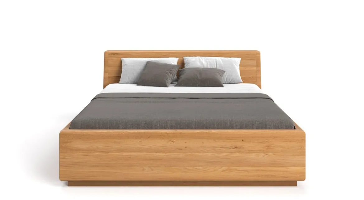 Designer Holzbett Calveno aus massiver Eiche mit Stauraum und geneigtem Headboard