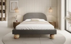 Designer Polsterbett Milo in Bouclé mit runden Holzfüßen