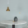 Pendelleuchte „Impala" – Aus messingfarbenem Aluminium