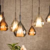 Pendelleuchte "Lumora“ – 7 tropfenförmige Glasschirme in Bernstein, Kupfer und Chrom